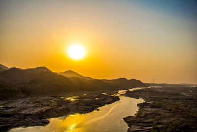 Scenic view of sea against sky during sunset