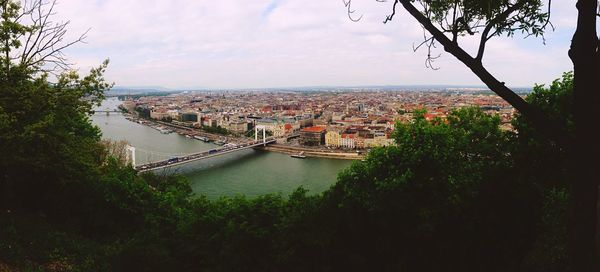 View of bridge over river in city