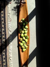 Directly above shot of pears on wooden plate