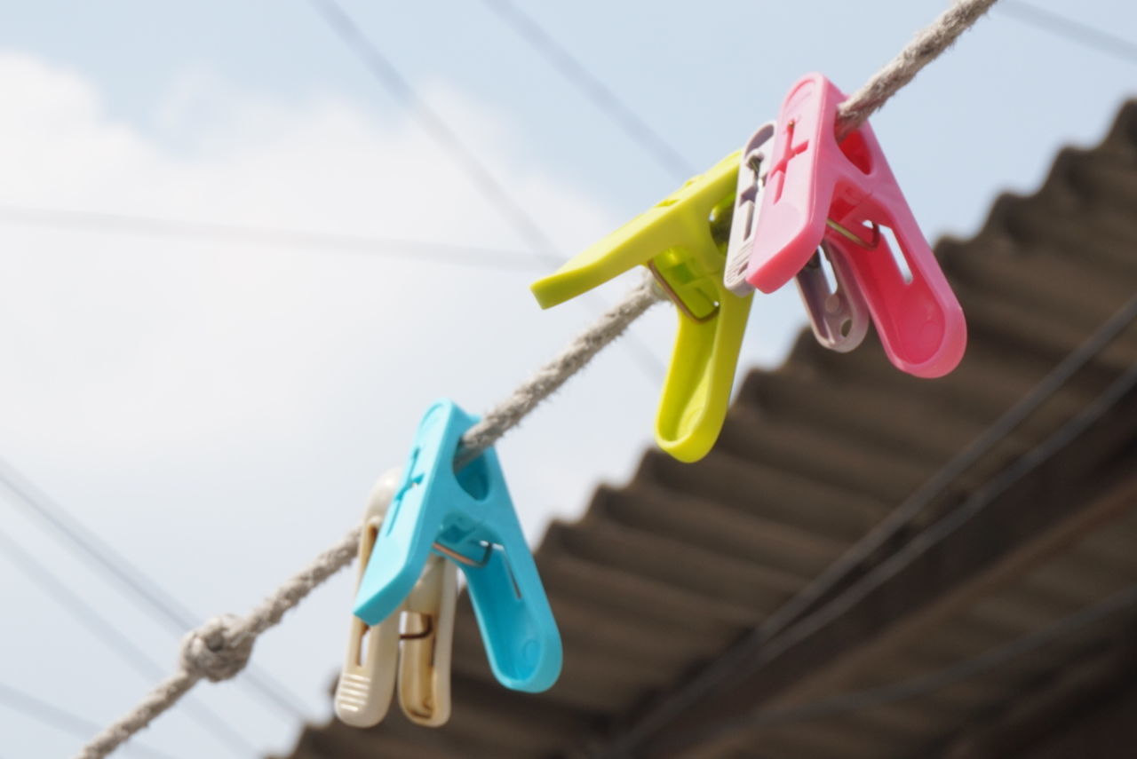 close-up, still life, clothespin, plastic, metal, hanging, blue, high angle view, indoors, no people, focus on foreground, multi colored, equipment, variation, selective focus, clothesline, rope, red, childhood, day