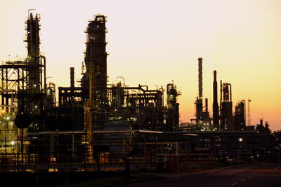 Factory against sky at night