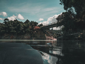 Bridge over river against sky