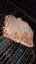 High angle view of meat on barbecue grill