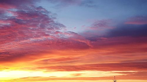 Low angle view of dramatic sky during sunset