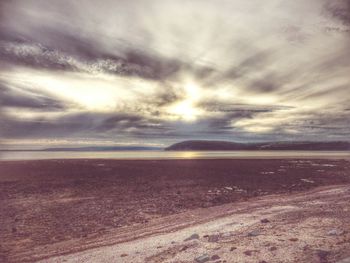 Scenic view of sea against cloudy sky