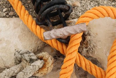 High angle view of ropes tied on metal