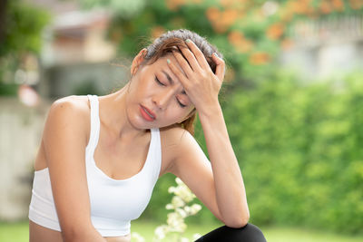 Midsection of woman wearing hat outdoors