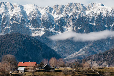 Scenic view of snowcapped mountains from a mountain village.