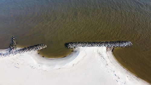 High angle view of deck chairs on beach