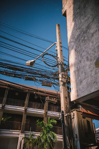 Low angle view of buildings against blue sky