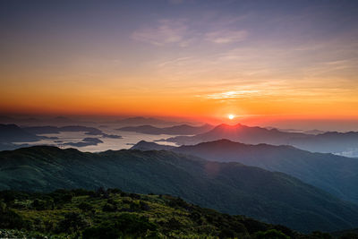 Scenic view of mountains against sky during sunset