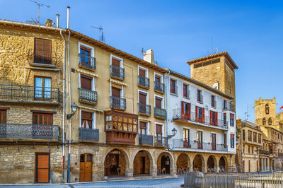 Low angle view of buildings against blue sky