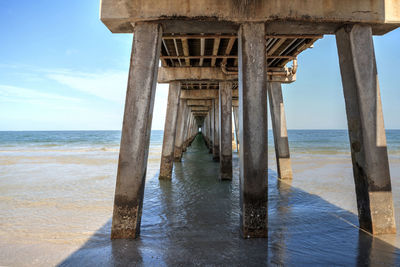 Pier over sea against sky