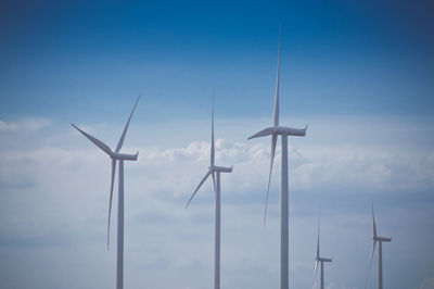 Low angle view of wind turbine against sky