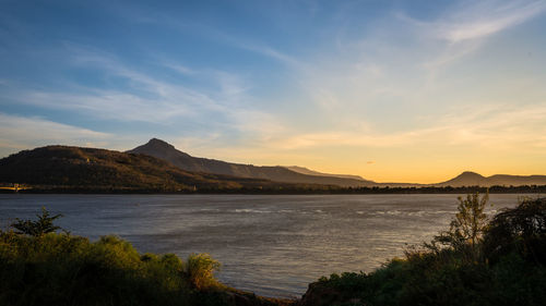 Scenic view of lake against sky during sunset