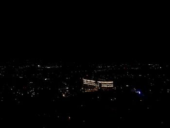 High angle view of illuminated buildings in city at night