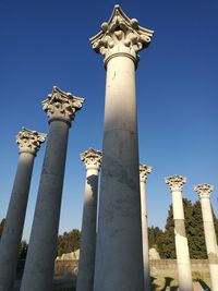 Low angle view of bell tower against blue sky