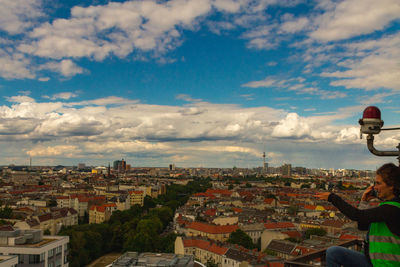 High angle view of city buildings against sky