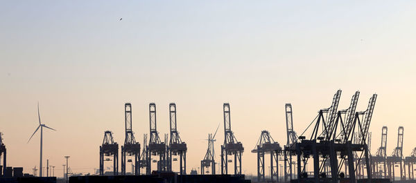 Hamburg harbor dockside cranes at dusk, hamburg, germany