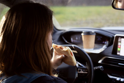 Portrait of woman in car