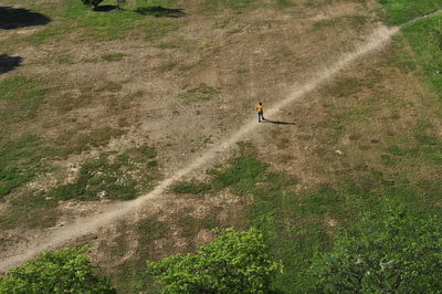 High angle view of man skateboarding on field