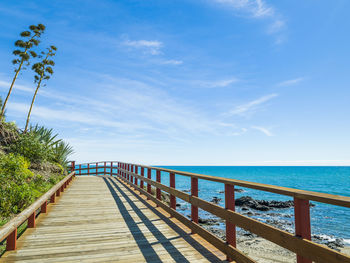 Wooden walkway in calahonda beach, mijas, malaga, spain