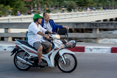 Woman riding bicycle on road