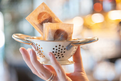 Close-up of hand holding ice cream