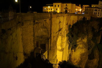 Buildings in city at night