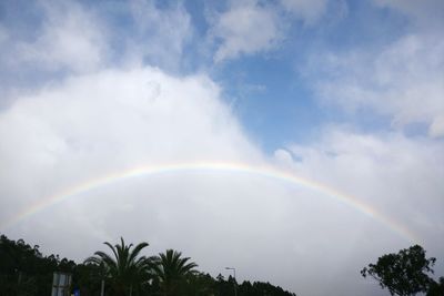 Low angle view of rainbow in sky