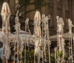 Close-up of water fountain against building