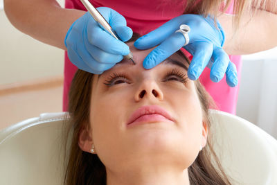 Woman getting eyebrows done