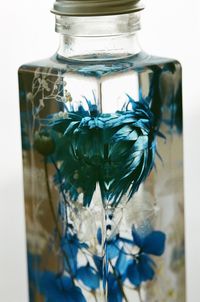 Close-up of plant in glass jar on table