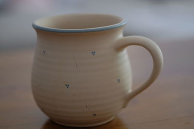 Close-up of coffee cup on table