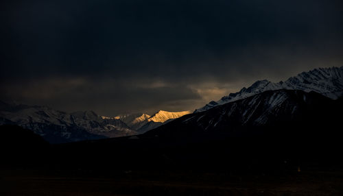 Scenic view of mountains against sky during sunset