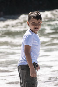 Portrait of boy on sea shore