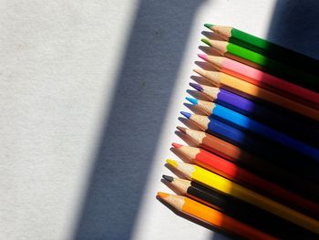 High angle view of multi colored pencils on table