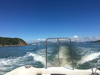 Scenic view of sea against clear blue sky