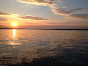 Scenic view of calm sea at sunset