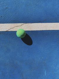Directly above shot of ball on blue court