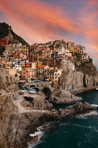 Townscape by sea against sky