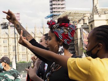 People photographing on street in city