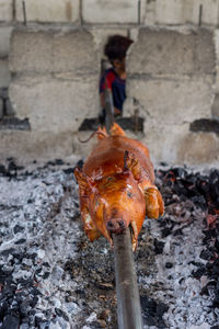 Man on barbecue grill