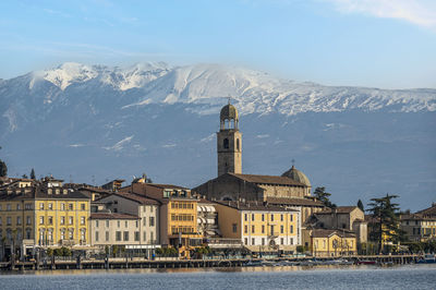 The beautiful lakeside of salò with the lake garda and the monte baldo in background