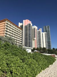 Modern buildings against sky in city