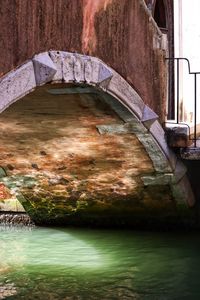 Abandoned building by lake