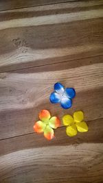 Close-up of flowers on wooden table