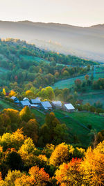 Scenic view of field and mountains against sky