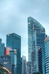 Low angle view of modern buildings against sky