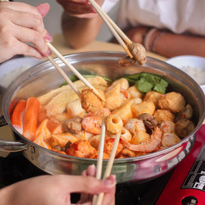 Midsection of woman preparing food